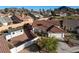 Single-story home featuring a tile roof, attached garage, separate storage building, and desert landscaping at 159 Coastal Pier Ct, Henderson, NV 89002