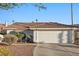 Charming one-story home features a tile roof, low maintenance landscaping, and an attached two-car garage at 159 Coastal Pier Ct, Henderson, NV 89002