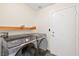 Modern laundry room featuring new Samsung washer and dryer at 159 Coastal Pier Ct, Henderson, NV 89002