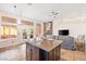 Open living room with tiled floor, and access to outdoor patio at 159 Coastal Pier Ct, Henderson, NV 89002