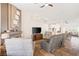 Spacious living room with a stylish fireplace, comfortable seating, and an open floor plan at 159 Coastal Pier Ct, Henderson, NV 89002