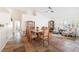 Bright open-concept living and dining area, with stylish decor, and comfortable sitting chairs at 159 Coastal Pier Ct, Henderson, NV 89002