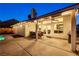 Covered patio with a full dining set and a view of the manicured yard and sparkling pool at 159 Coastal Pier Ct, Henderson, NV 89002
