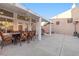 Covered patio featuring an outdoor dining set and barbecue area at 159 Coastal Pier Ct, Henderson, NV 89002