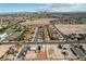 Expansive aerial view of a neighborhood near Las Vegas with desert landscape and beautiful mountain scenery at 1608 June Ave, North Las Vegas, NV 89032