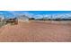 This property has a spacious backyard with gravel and chain link fence at 1608 June Ave, North Las Vegas, NV 89032