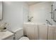 This bathroom has a walk-in tub and a white sink at 1608 June Ave, North Las Vegas, NV 89032