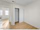 Bedroom featuring wood-look floors and a closet for storage at 1608 June Ave, North Las Vegas, NV 89032