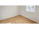 Bedroom featuring wood-look floors and a window to let in sunlight at 1608 June Ave, North Las Vegas, NV 89032