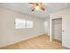 Spacious bedroom with closet, wood look flooring, and modern ceiling fan at 1608 June Ave, North Las Vegas, NV 89032