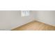Bedroom featuring wood-look floors and a window to let in natural light at 1608 June Ave, North Las Vegas, NV 89032