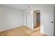 Bedroom featuring wood-look floors, a closet and plenty of natural light at 1608 June Ave, North Las Vegas, NV 89032