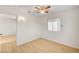 Bedroom with wood-look flooring and modern ceiling fan at 1608 June Ave, North Las Vegas, NV 89032