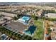 Birds-eye view of the community pool, recreational area, and park with shade and picnic areas at 1608 June Ave, North Las Vegas, NV 89032