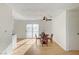 Open dining area with wood look floors, ceiling fan and natural light at 1608 June Ave, North Las Vegas, NV 89032