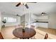 Dining area with laminate floors and open layout to the kitchen and living room at 1608 June Ave, North Las Vegas, NV 89032