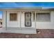 Welcoming front porch with decorative window bars adding charm to the home's entrance at 1608 June Ave, North Las Vegas, NV 89032