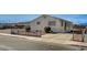 Charming single-story home featuring a paved driveway and minimalist landscaping, fenced for added privacy at 1608 June Ave, North Las Vegas, NV 89032