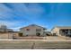 A single-story home with a simple design, complemented by a practical driveway and minimal landscaping at 1608 June Ave, North Las Vegas, NV 89032