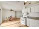 Bright kitchen with white appliances, granite counters, adjacent to dining area at 1608 June Ave, North Las Vegas, NV 89032