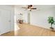Living room area with laminate flooring and natural light coming through a sliding glass door at 1608 June Ave, North Las Vegas, NV 89032