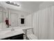 Well-lit bathroom featuring a sink, toilet, and shower with modern finishes at 201 Crown Imperial St, Henderson, NV 89074