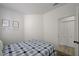 Comfortable bedroom showing bed, framed photos, and closet access at 201 Crown Imperial St, Henderson, NV 89074