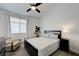 Cozy bedroom with soft carpet, ceiling fan, and natural light from the window at 201 Crown Imperial St, Henderson, NV 89074