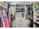 Organized walk-in closet with shelves, hanging rods, and drawers for ample storage at 201 Crown Imperial St, Henderson, NV 89074