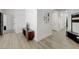 Hallway leading to living spaces with hardwood floors at 201 Crown Imperial St, Henderson, NV 89074