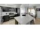 Stylish kitchen featuring quartz countertops, stainless steel appliances, and island seating at 201 Crown Imperial St, Henderson, NV 89074