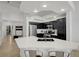 Well-lit kitchen featuring a large island with seating, stainless steel appliances, and modern finishes at 201 Crown Imperial St, Henderson, NV 89074