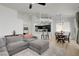 Cozy living room and dining area with open floor plan, modern lighting, and kitchen view at 201 Crown Imperial St, Henderson, NV 89074