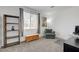 Inviting living room with comfortable seating, large window and storage shelving at 201 Crown Imperial St, Henderson, NV 89074