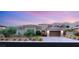 Charming one-story stucco home with desert landscaping, tile roof, and a two-car garage in a gated community at 21 Grand Masters Dr, Las Vegas, NV 89141