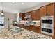 Well-equipped kitchen featuring granite countertops, stainless steel appliances, and custom cabinetry at 21 Grand Masters Dr, Las Vegas, NV 89141