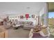 Open living space features comfortable seating, modern decor, and access to outdoor area at 2261 Cold Canyon Ave, North Las Vegas, NV 89086