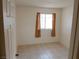 Bedroom features neutral walls and tile flooring at 2471 Old Forge Ln # 105, Las Vegas, NV 89121