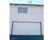 Exterior shot of garage with satellite dish installed on the roof of the home at 2471 Old Forge Ln # 105, Las Vegas, NV 89121