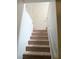 Carpeted staircase leading to the upper level at 2471 Old Forge Ln # 105, Las Vegas, NV 89121