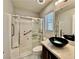 Clean bathroom with a glass shower, modern vanity, and stylish dark fixtures, offers accessibility features at 248 Crystal Rose Ct, Las Vegas, NV 89106