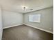 Simple bedroom with wood-look floors, neutral walls, and a window with blinds for natural light at 248 Crystal Rose Ct, Las Vegas, NV 89106