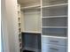 Organized closet with white shelving, drawers, and hanging rods for optimal storage at 248 Crystal Rose Ct, Las Vegas, NV 89106