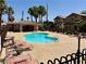Relaxing community pool with shade structures and lounge seating surrounded by well-maintained landscaping at 248 Crystal Rose Ct, Las Vegas, NV 89106