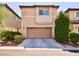 Two-story home featuring a two-car garage and desert landscaping at 248 Crystal Rose Ct, Las Vegas, NV 89106