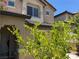 Two-story home featuring a stucco exterior, trimmed windows, and well-maintained landscaping at 248 Crystal Rose Ct, Las Vegas, NV 89106