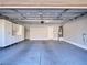Spacious two car garage with epoxy flooring and white storage cabinets at 248 Crystal Rose Ct, Las Vegas, NV 89106