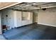 Finished garage with epoxy floor and built-in cabinets for optimal storage solutions at 248 Crystal Rose Ct, Las Vegas, NV 89106