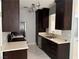 Modern kitchen featuring dark cabinetry, stainless steel appliances, and a stylish countertop at 248 Crystal Rose Ct, Las Vegas, NV 89106