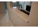Kitchen countertop pass-through featuring a stylish countertop and view to the living area at 248 Crystal Rose Ct, Las Vegas, NV 89106
